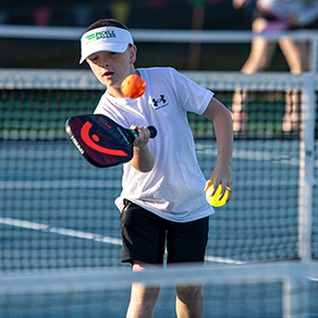 Young boy in pickleball tournament